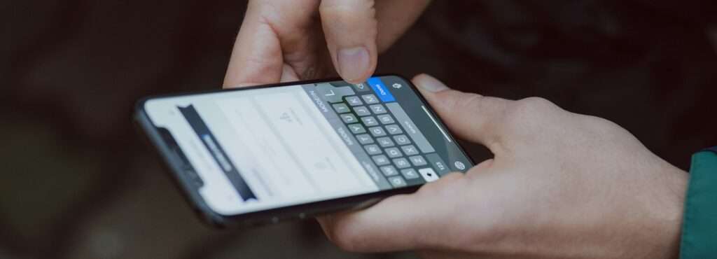 selective focus photography of person using smartphone