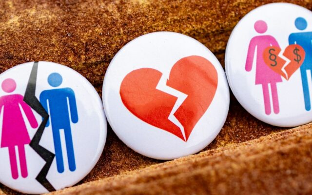 Three buttons with people and a broken heart on them